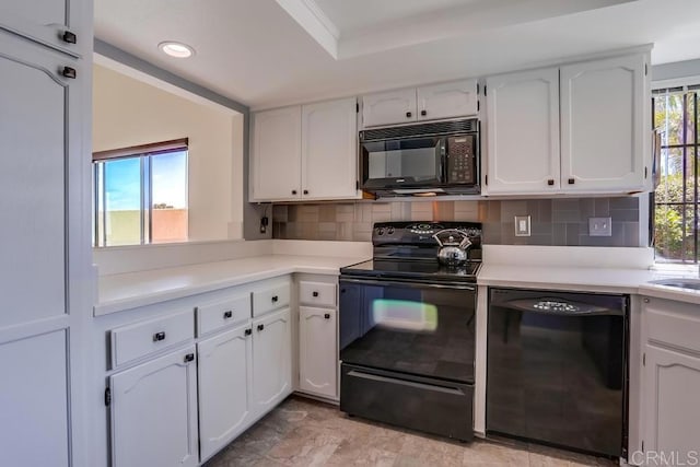 6942 Batiquitos, Carlsbad, CA 92011 - kitchen with black appliances, white cabinetry, tasteful backsplash, light countertops, and recessed lighting
