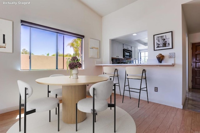 6942 Batiquitos, Carlsbad, CA 92011 - dining space featuring light wood-style flooring