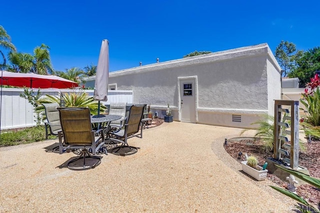 6942 Batiquitos, Carlsbad, CA 92011 - back of property with a patio, stucco siding, and outdoor dining space