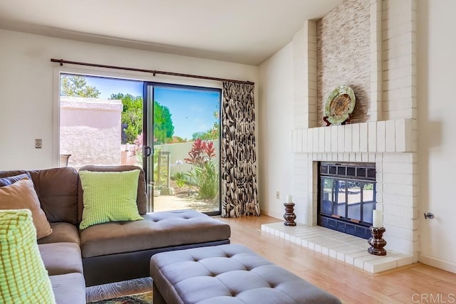 6942 Batiquitos, Carlsbad, CA 92011 - living room with wood finished floors and a fireplace