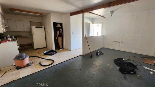 15236 Painted Hills Rd, Whitewater, CA 92282 - kitchen with freestanding refrigerator and concrete flooring