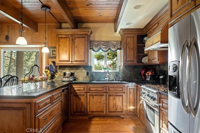 207 N Fairway Dr N, Lake Arrowhead, CA 92391 - kitchen featuring appliances with stainless steel finishes, a wooden ceiling with exposed beams, brown cabinets, and plenty of natural light