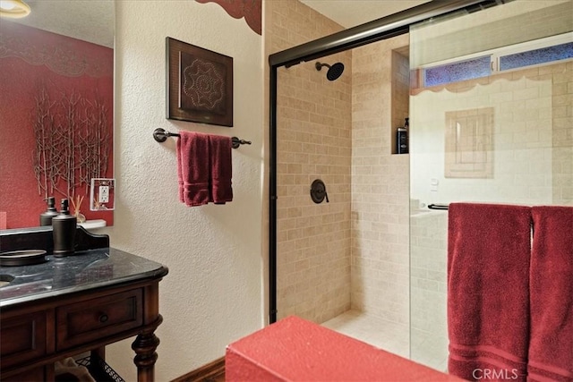 207 N Fairway Dr N, Lake Arrowhead, CA 92391 - full bathroom featuring a stall shower, vanity, and a textured wall