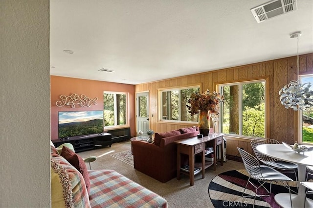 207 N Fairway Dr N, Lake Arrowhead, CA 92391 - living room featuring carpet, wooden walls, and a textured wall