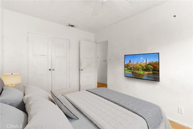1450 Pepper Tree Ln, San Bernardino, CA 92404 - bedroom featuring a closet, wood finished floors, and a ceiling fan