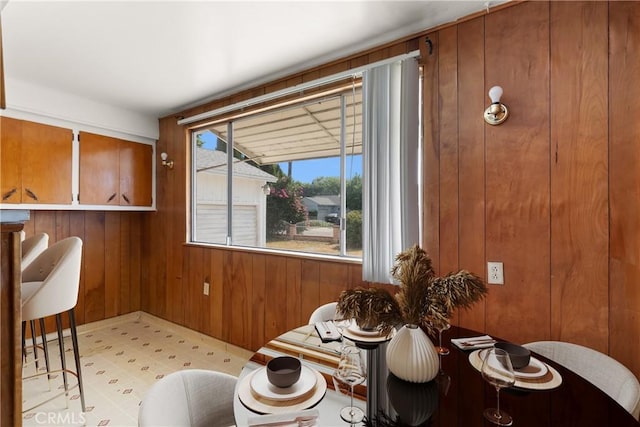 1450 Pepper Tree Ln, San Bernardino, CA 92404 - dining room with wood walls and light flooring