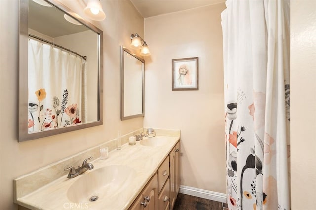 1434 N Rose St, Burbank, CA 91505 - bathroom with double vanity, wood finished floors, and a shower with shower curtain