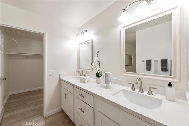 10 Windsong, Irvine, CA 92614 - full bath with double vanity, wood finished floors, and a walk in closet