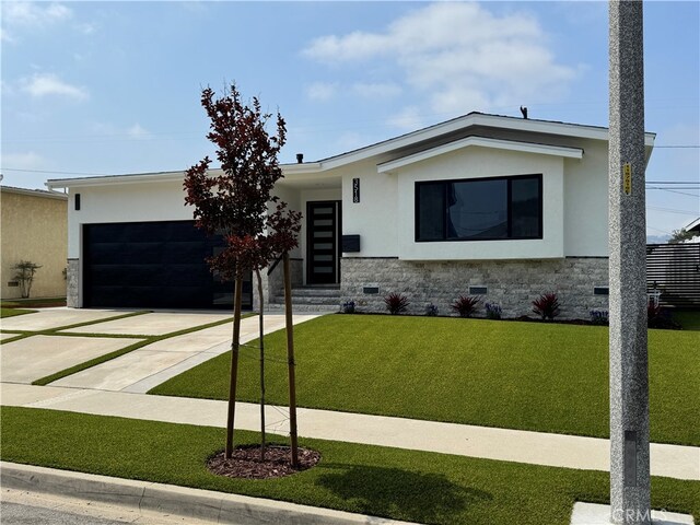3518 W 228th St, Torrance, CA 90505 - contemporary house with stucco siding, concrete driveway, an attached garage, a front lawn, and crawl space