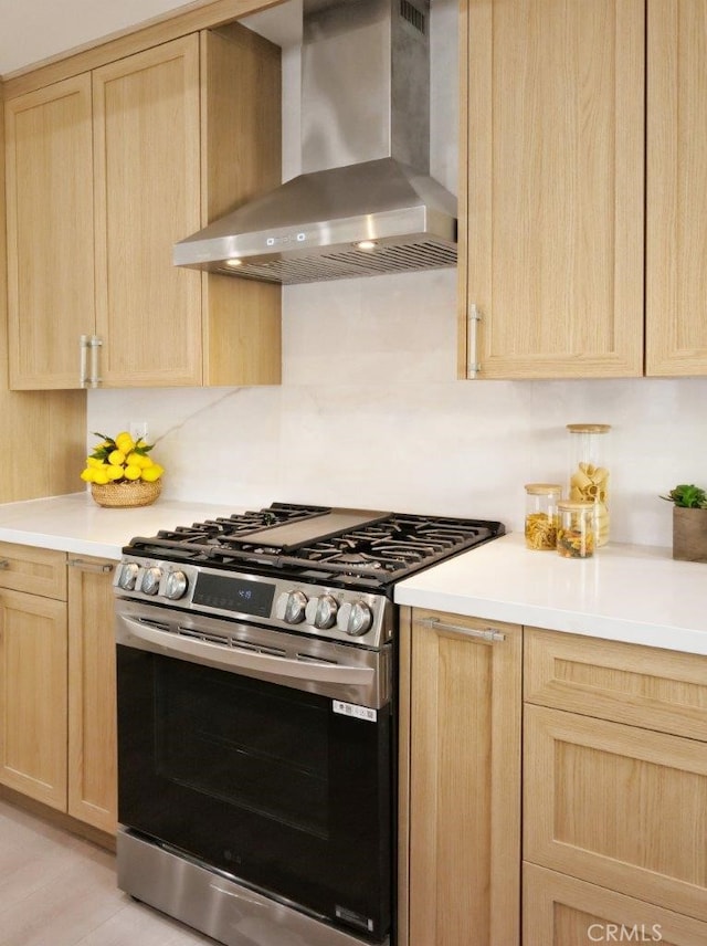 3518 W 228th St, Torrance, CA 90505 - kitchen featuring stainless steel gas stove, light brown cabinets, and wall chimney exhaust hood