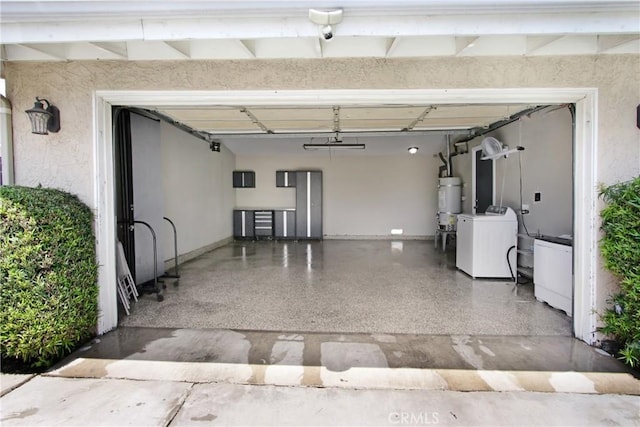 467 W Casad St, Covina, CA 91723 - garage featuring strapped water heater and independent washer and dryer