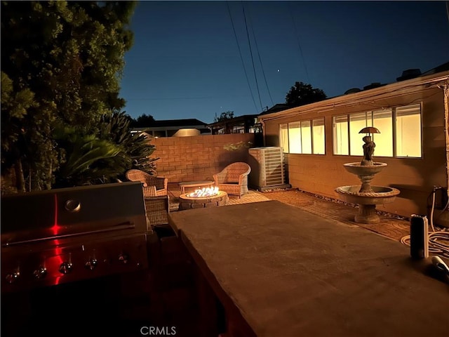 467 W Casad St, Covina, CA 91723 - patio at twilight featuring a patio and a fire pit
