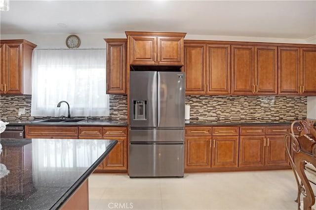 22329 Plummer St, Chatsworth, CA 91311 - kitchen with stainless steel fridge with ice dispenser, brown cabinets, decorative backsplash, and dark stone countertops