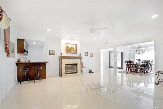 22329 Plummer St, Chatsworth, CA 91311 - living area with recessed lighting, a ceiling fan, tile patterned floors, a glass covered fireplace, and a chandelier