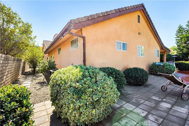 22329 Plummer St, Chatsworth, CA 91311 - view of side of property with a patio area and stucco siding
