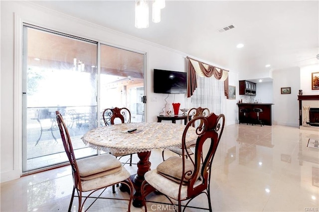 22329 Plummer St, Chatsworth, CA 91311 - dining room with ornamental molding, a fireplace, and recessed lighting