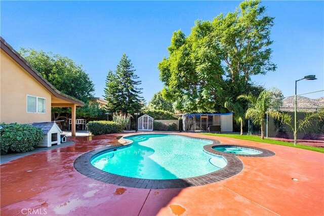 22329 Plummer St, Chatsworth, CA 91311 - view of pool featuring a shed, a patio area, and a pool with connected hot tub
