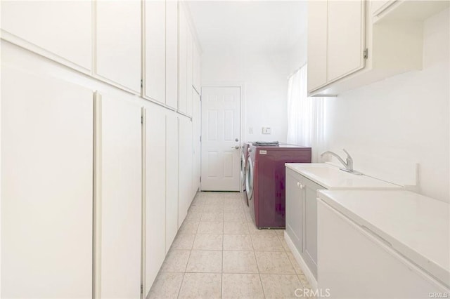 22329 Plummer St, Chatsworth, CA 91311 - washroom with washer and clothes dryer, cabinet space, and light tile patterned flooring