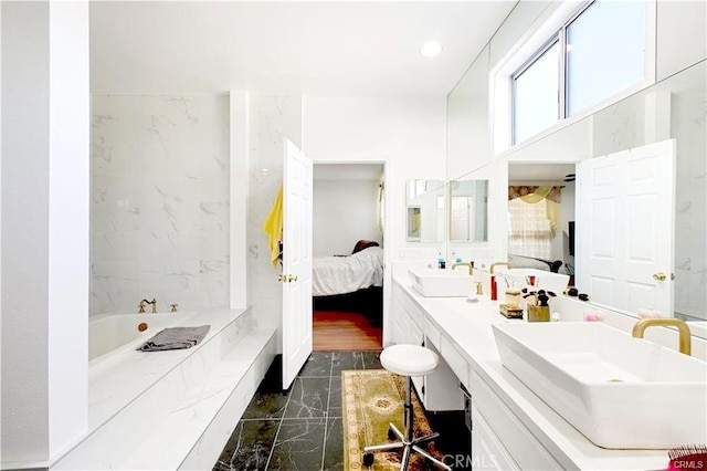 22329 Plummer St, Chatsworth, CA 91311 - ensuite bathroom featuring a garden tub, marble tiled floors, double vanity, and recessed lighting
