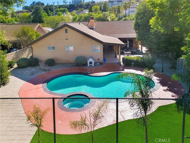 22329 Plummer St, Chatsworth, CA 91311 - view of swimming pool featuring a patio area and a pool with connected hot tub