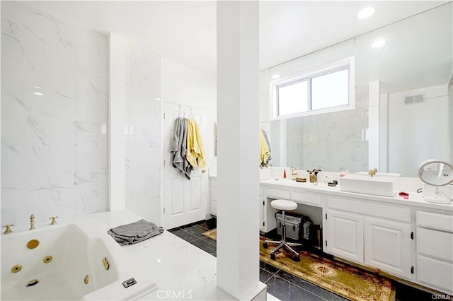 22329 Plummer St, Chatsworth, CA 91311 - full bath with marble tiled flooring, a tub with jets, and vanity