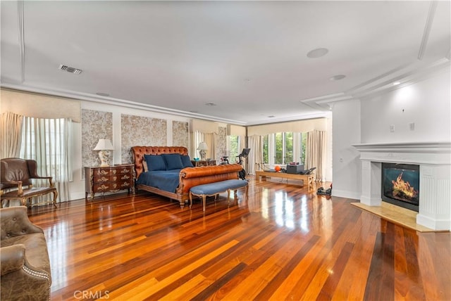 919 S Gretna Green Way, Los Angeles, CA 90049 - bedroom featuring wood finished floors, a fireplace with flush hearth, and ornamental molding