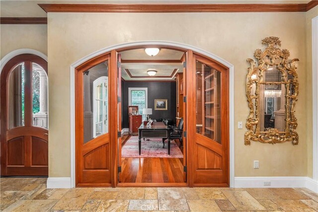 919 S Gretna Green Way, Los Angeles, CA 90049 - entrance foyer with stone tile floors, crown molding, and arched walkways