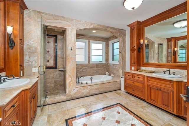 919 S Gretna Green Way, Los Angeles, CA 90049 - bathroom with two vanities, a garden tub, a shower stall, and marble tiled floors