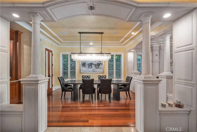 919 S Gretna Green Way, Los Angeles, CA 90049 - dining space featuring decorative columns, crown molding, plenty of natural light, and a chandelier