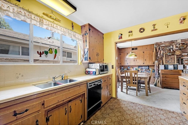 15043 Tuba St, San Fernando, CA 91345 - kitchen featuring black dishwasher, stainless steel microwave, backsplash, tile countertops, and carpet floors