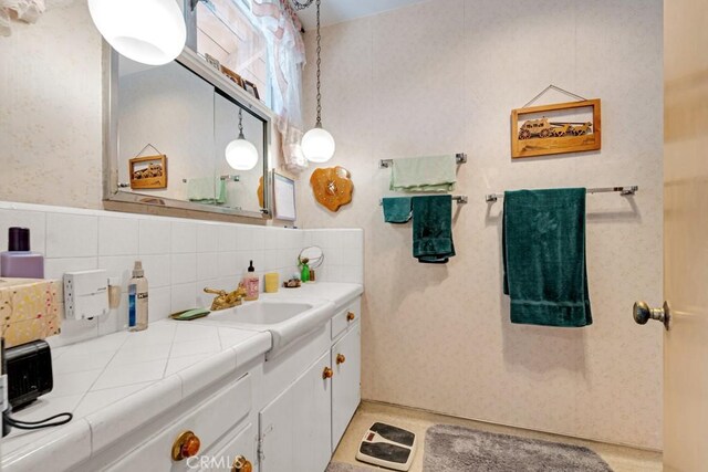 15043 Tuba St, San Fernando, CA 91345 - bathroom with vanity and tasteful backsplash