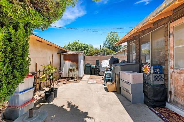 15043 Tuba St, San Fernando, CA 91345 - fenced backyard featuring a shed and a patio area