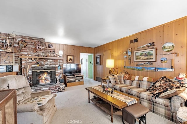 15043 Tuba St, San Fernando, CA 91345 - living room with light colored carpet, wooden walls, and a fireplace