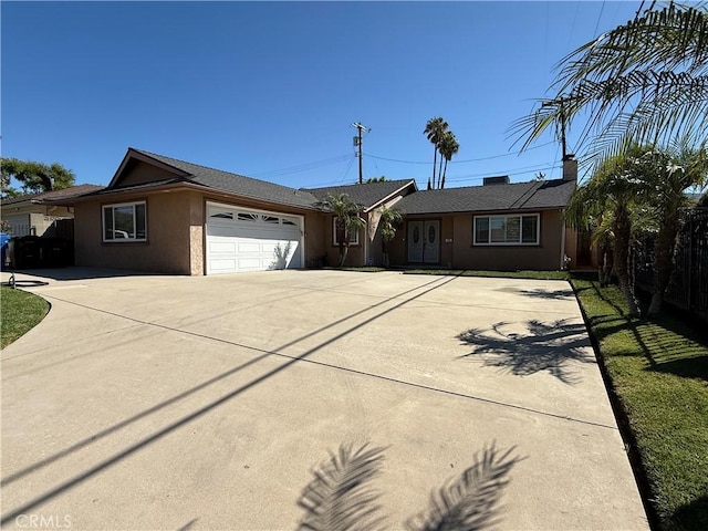 13036 Kismet Ave, Sylmar, CA 91342 - ranch-style home with driveway, a garage, and stucco siding
