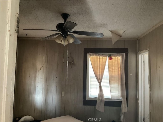 1330 E 56th St, Long Beach, CA 90805 - bedroom featuring crown molding, wooden walls, and a textured ceiling