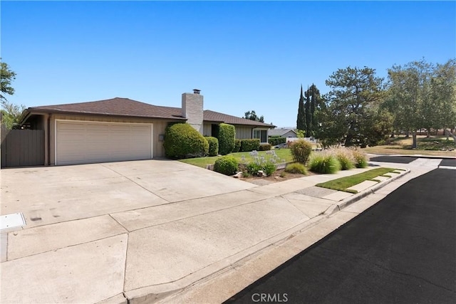 1225 Carlsbad St, Placentia, CA 92870 - single story home with concrete driveway, a garage, and a chimney