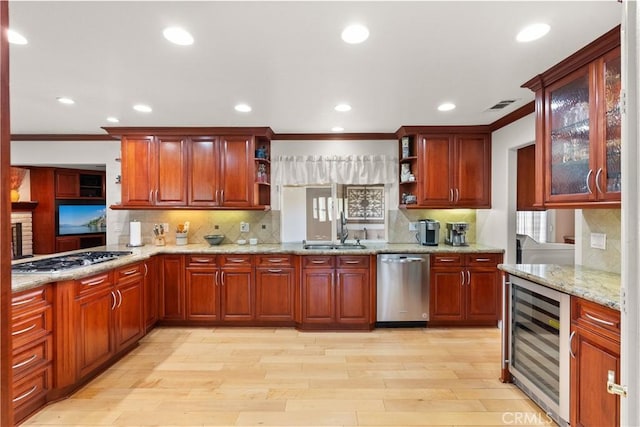 1225 Carlsbad St, Placentia, CA 92870 - kitchen with stainless steel appliances, beverage cooler, open shelves, crown molding, and light wood-style flooring