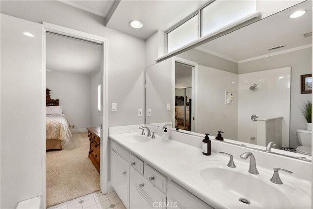 1225 Carlsbad St, Placentia, CA 92870 - ensuite bathroom featuring double vanity, ornamental molding, and recessed lighting