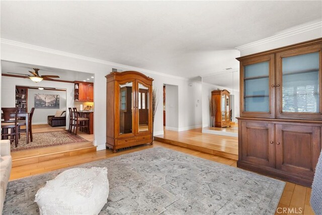 1225 Carlsbad St, Placentia, CA 92870 - entryway with light wood finished floors, crown molding, and a ceiling fan