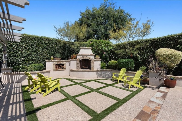 1225 Carlsbad St, Placentia, CA 92870 - view of patio with an outdoor stone fireplace
