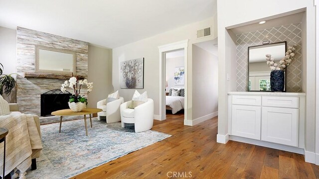 23782 Lagarto, Mission Viejo, CA 92691 - living area with wood-type flooring and a large fireplace