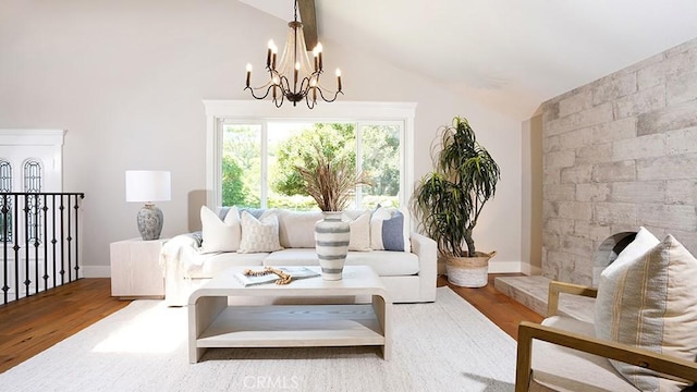 23782 Lagarto, Mission Viejo, CA 92691 - living room featuring vaulted ceiling, a chandelier, and wood finished floors