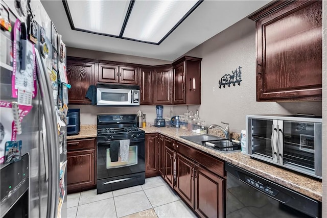 12268 Pluto Dr, Victorville, CA 92392 - kitchen featuring black appliances, light tile patterned flooring, dark brown cabinets, a textured wall, and light stone countertops
