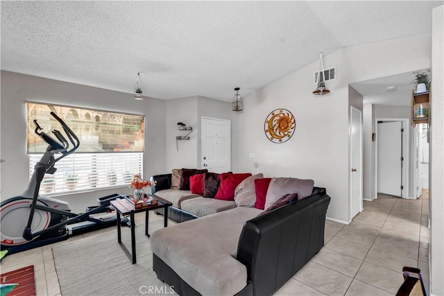 12268 Pluto Dr, Victorville, CA 92392 - living room with a textured ceiling, light tile patterned flooring, and lofted ceiling