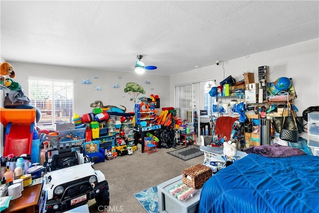 12268 Pluto Dr, Victorville, CA 92392 - bedroom with multiple windows, carpet, a textured ceiling, a closet, and a ceiling fan