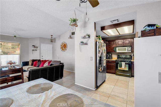 12268 Pluto Dr, Victorville, CA 92392 - kitchen with black range with gas stovetop, stainless steel fridge, a textured ceiling, a ceiling fan, and freestanding refrigerator