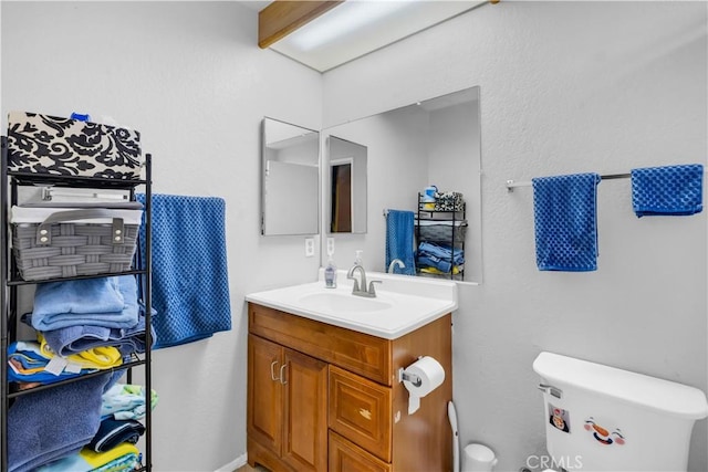 12268 Pluto Dr, Victorville, CA 92392 - bathroom with toilet and vanity