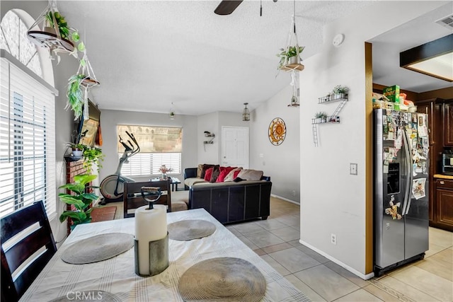 12268 Pluto Dr, Victorville, CA 92392 - dining space with light tile patterned flooring, a ceiling fan, and a textured ceiling