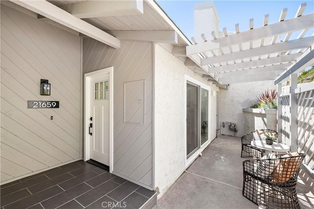 21659 Ocean Vista Dr Unit 20, Laguna Beach, CA 92651 - doorway to property with a pergola and stucco siding
