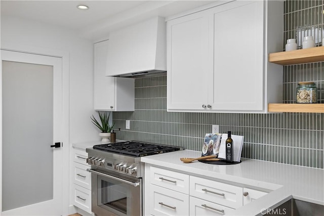21659 Ocean Vista Dr Unit 20, Laguna Beach, CA 92651 - kitchen featuring stainless steel stove, premium range hood, tasteful backsplash, light countertops, and recessed lighting